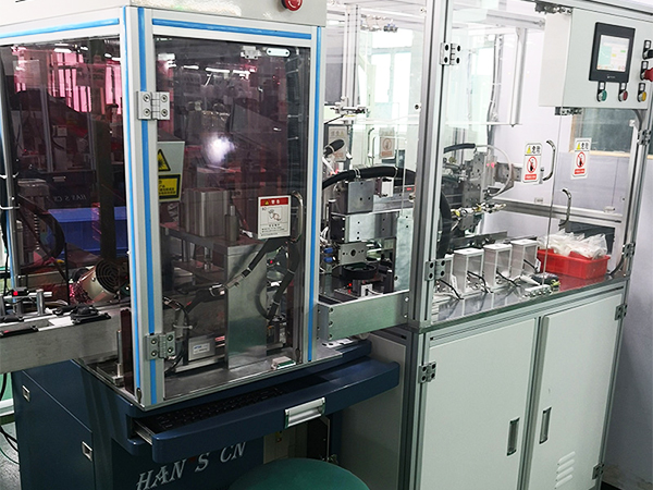 Laser coding and automatic electric inspection machine